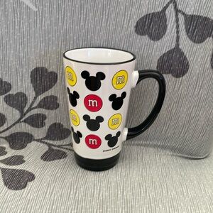 M&M coffee mug. NWT. 6 inches he's tall. It is a combo M&M and mickey ears mug